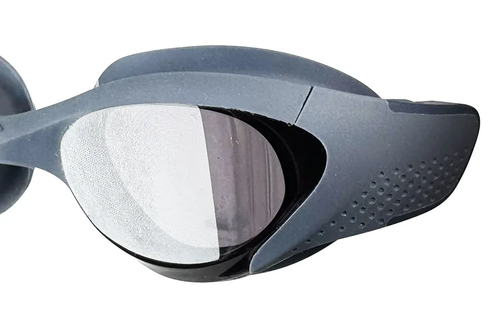 Physical swim goggle prototype on a fit-testing rig at the Eyeline pilot line