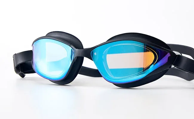 Swimmer underwater in a pool wearing Eyeline swim goggles