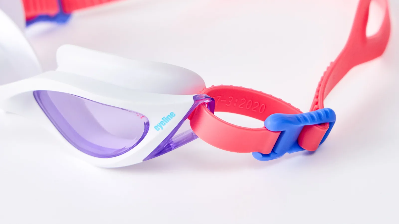Eyeline Vortex Junior junior swim goggle, go fast or go faster design, hero 3/4 lens close-up